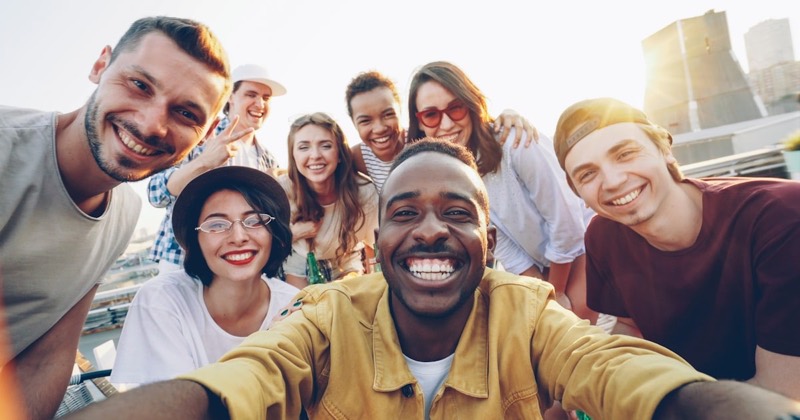 Young adults hiking together on a trail near NYC.