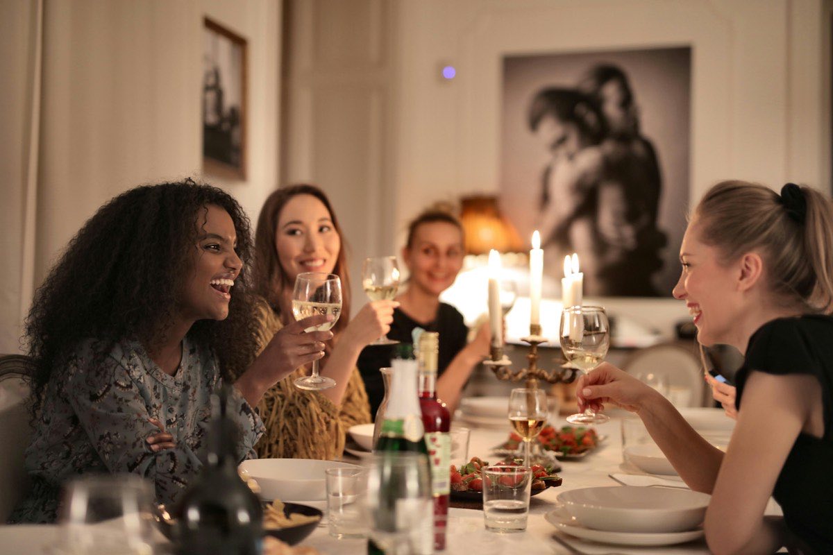 Adults at a dinner table connecting over food