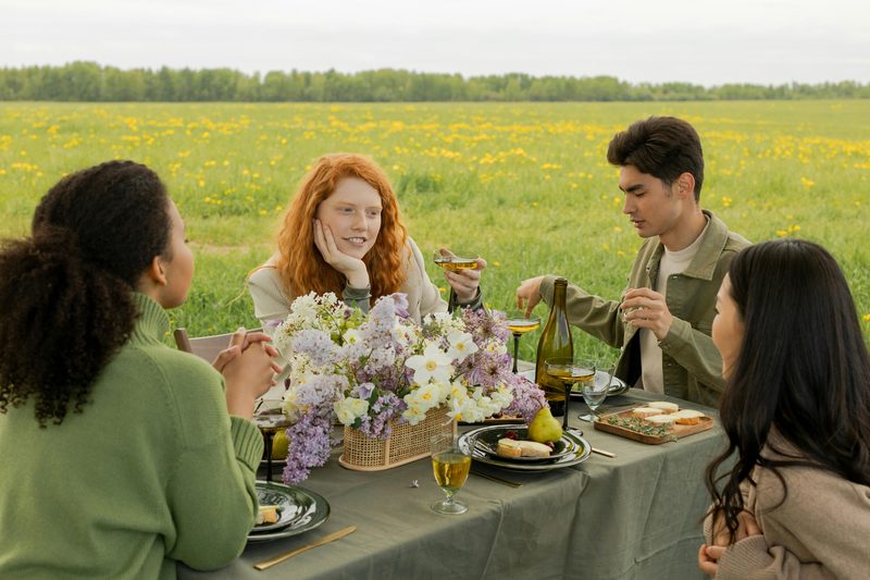 Group of women friends laughing outdoors on a sunny day